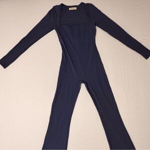 Chic Navy Long Sleeve Jumpsuit with Flare Bottoms
